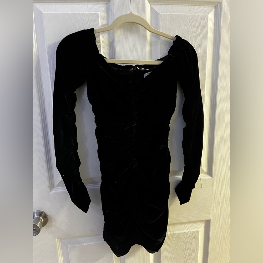 A black dress from Zara in the size xs